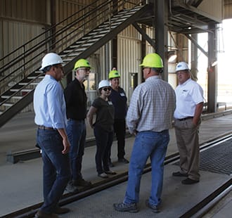The final stop, before heading back to Spokane, was the McCoy Grain Terminal. Tour members watched grain trucks unloading and the grain being tested. They got a crash course in elevator operations and learned how grain piles are used to manage grain flow.