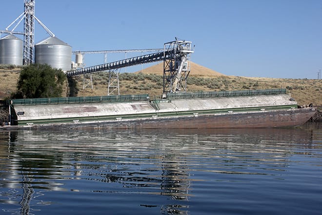 A barge being loaded with grain at Tri-Cities Grain. Did you know that one four-barge tow moves the same amount of cargo as 140 rail cars or 538 trucks?