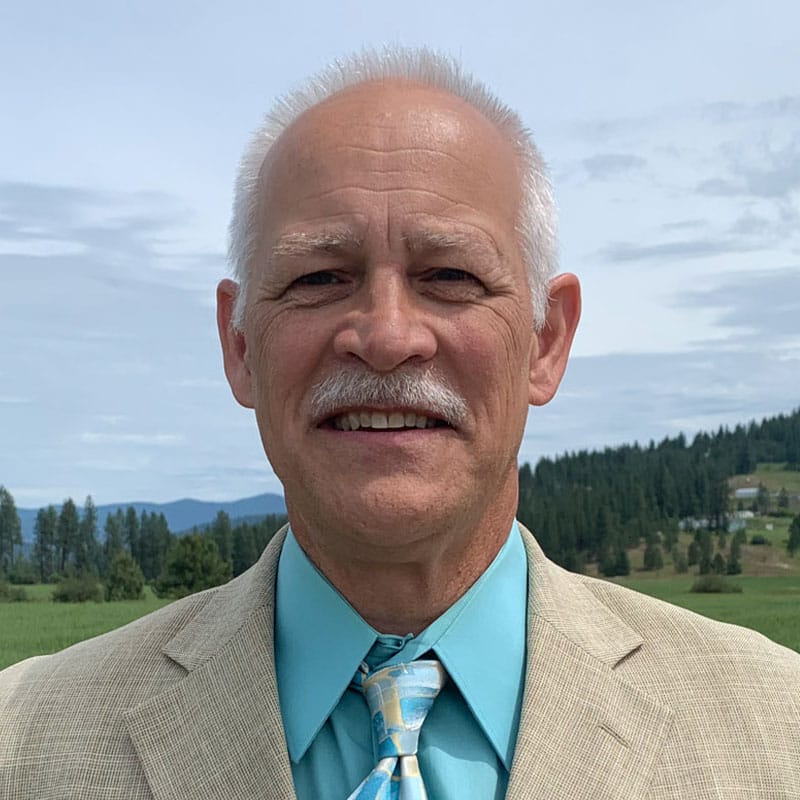 Smiling older man in suit outdoors